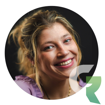 Portrait of a smiling woman in a circular frame.